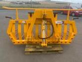 Hydraulic tipping stone fork with tool/weight box